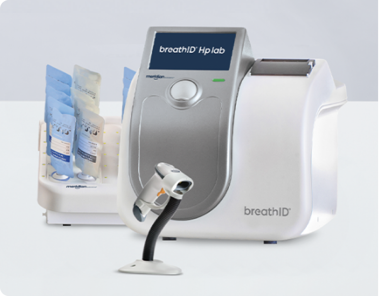 BreathID HP Lab breath analysis system with a mouthpiece connected and disposable sample bags on the left in a lab setup.