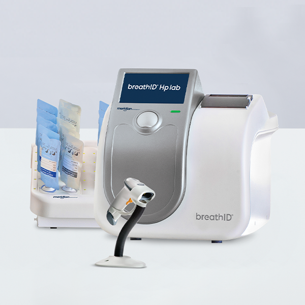 BreathID Hp Lab medical analyzer with a mouthpiece attached, disposable tubes on the left, on a white surface.